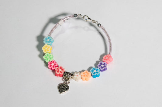 Bracciale semirigino con grani in gomma multicolore e cuore in metallo  - Magnificat